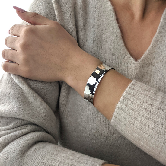 
                    
                      Sterling silver hammered cuff bangle — textured shimmering finish
                    
                  
