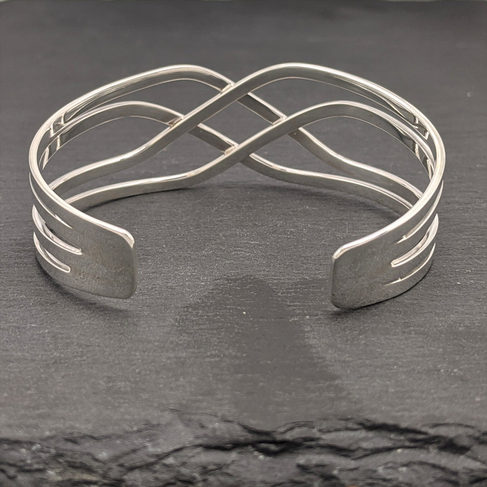 
                  
                    Sterling Silver Wide Crossover Celtic Knot Adjustable Cuff Bangle
                  
                