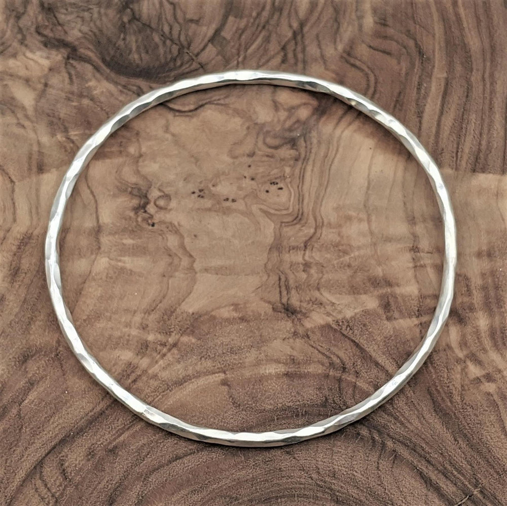 
                  
                    Karen Hill Tribe Silver Minimalist Hammered Tube Stackable Bangle
                  
                