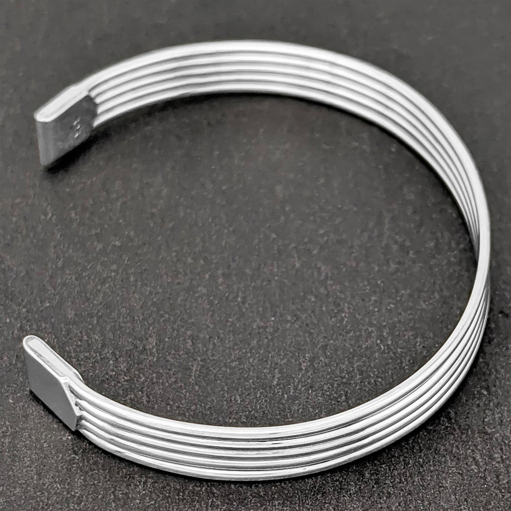 
                  
                    Sterling Silver Simple Flat Grooved Band Adjustable Cuff Bracelet
                  
                