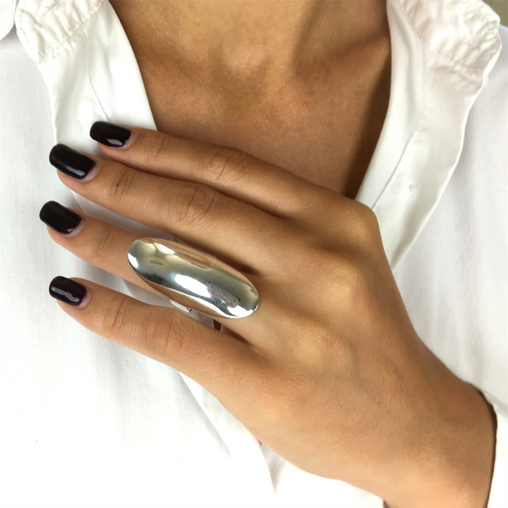 Sterling silver long armour ring shown from the front — undulated chunky band, statement knuckle design