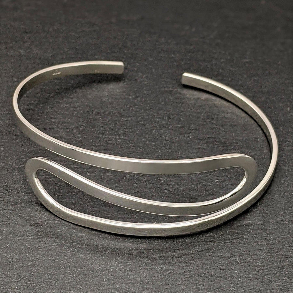 
                  
                    Sterling Silver Ribbon Twist Loop Adjustable Open Cuff Bracelet
                  
                