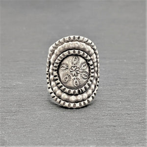 
                  
                    Hill Tribe Silver Wide Disc Engraved Flower Motif Adjustable Shield Ring
                  
                