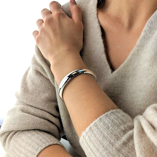 
                    
                      Sterling silver chunky bangle — 12mm wide stacking bracelet with polished mirror finish
                    
                  