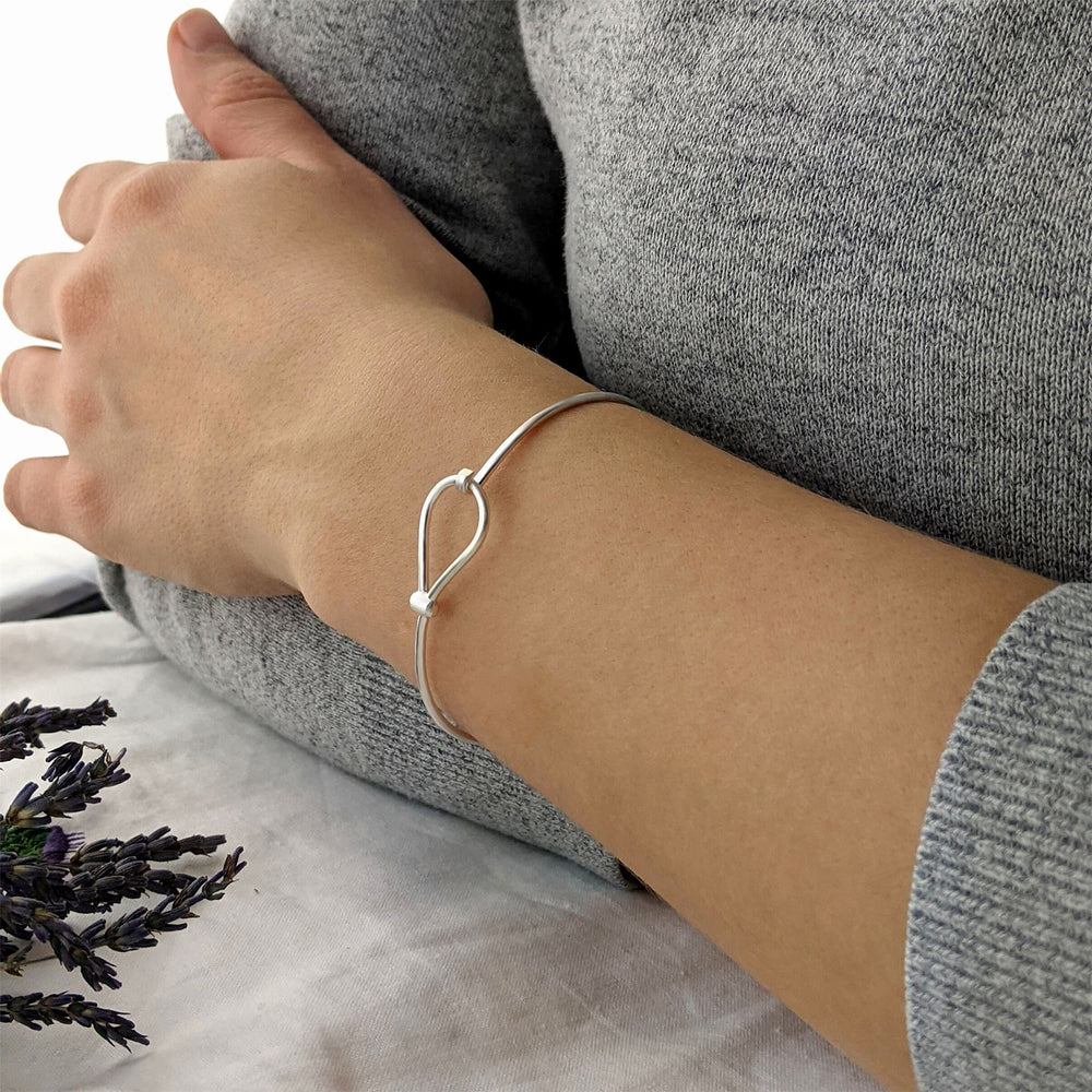
                  
                    Sterling Silver Simple Loop Knot Thin Tube Bangle With Hook Clasp
                  
                