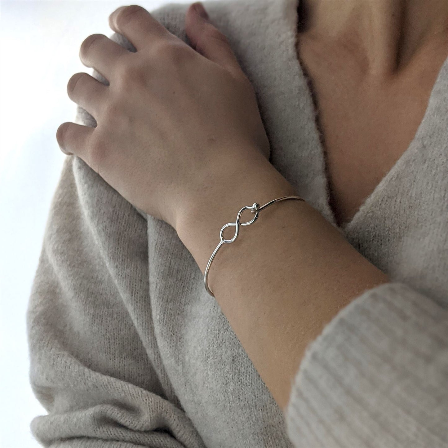 
                  
                    Sterling Silver Thin Wire Infinity Symbol Bangle With Hook Clasp
                  
                