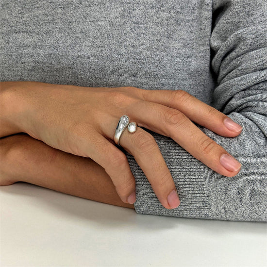 
                    
                      Sterling silver chunky teardrop ring with open wraparound design.
                    
                  