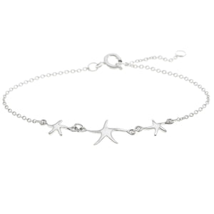 
                  
                    Sterling Silver Triple Starfish Star Charm Cable Chain Bracelet
                  
                