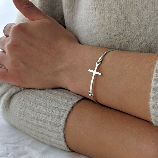 
                    
                      Simple sterling silver cross bangle for women
                    
                  