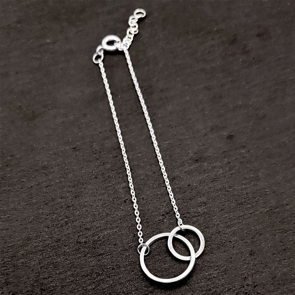 
                  
                    Sterling Silver Interlocking Circles Double Circle Thin Chain Bracelet
                  
                