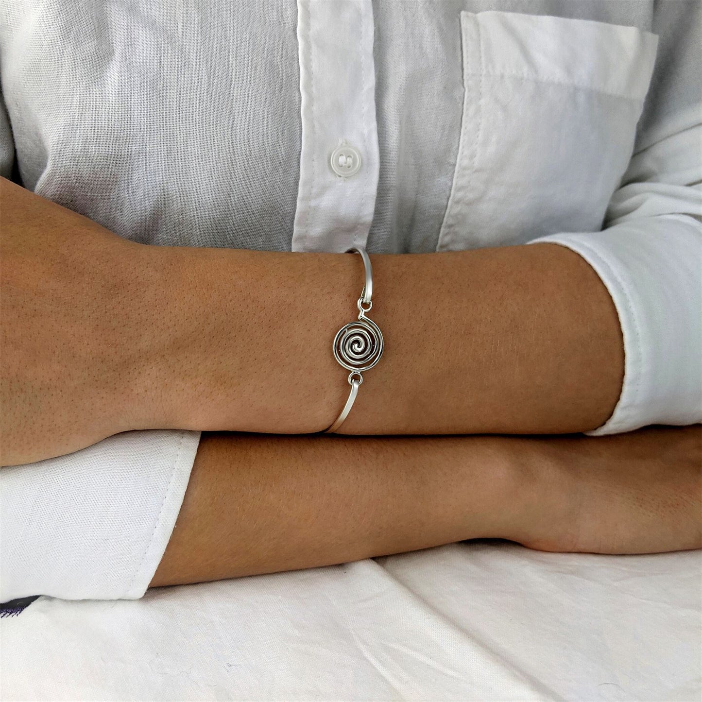 
                  
                    Sterling Silver Thin Elegant Round Spiral Bangle With Hook Clasp
                  
                