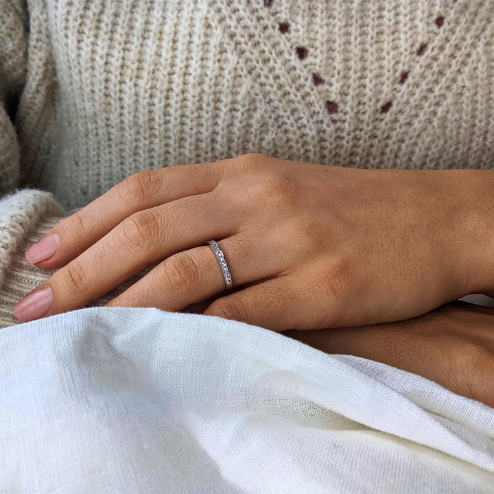 Sterling silver half eternity ring with channel-set cubic zirconia stones