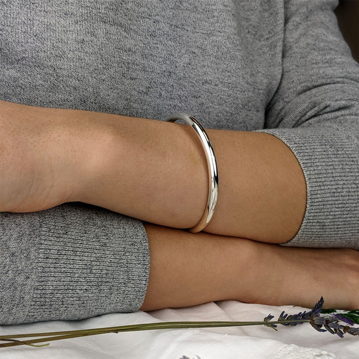 Sterling silver classic bangle — polished D-shape design