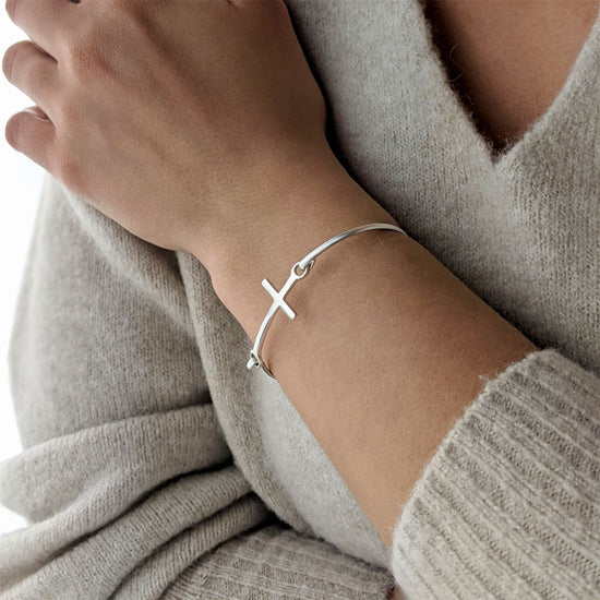 
                    
                      Horizontal cross bangle in sterling silver — delicate symbolic 925 silver piece for everyday wear
                    
                  